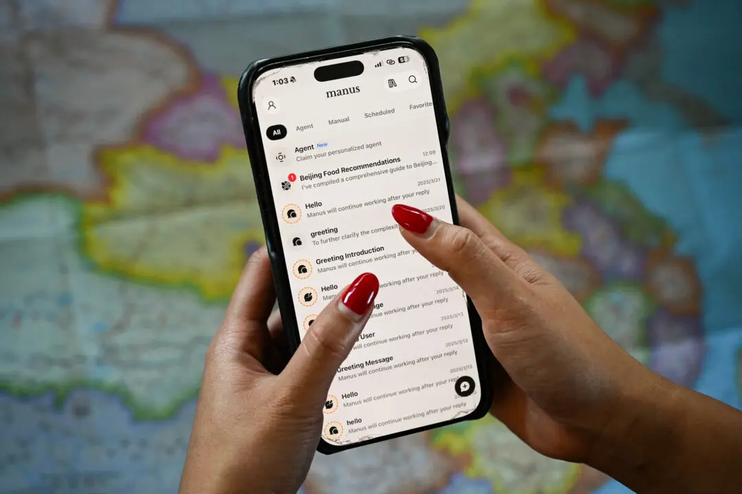 This photo illustration shows the Manus app on a mobile phone in Beijing on April 28, 2026. China’s move to block Meta’s acquisition drew international attention because Manus had already shifted abroad, with its parent company reincorporated in Singapore. (Greg Baker/AFP via Getty Images)