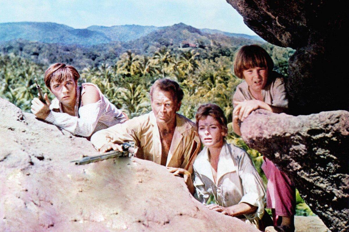 (L–R) Ernst Robinson (Tommy Kirk), Father Robinson (John Mills), Mother Robinson (Dorothy McGuire), and Francis (Kevin Corcoran), in “Swiss Family Robinson” (Walt Disney Pictures)