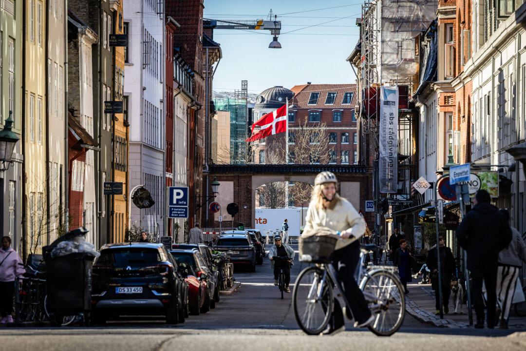 People commute in Copenhagen, Denmark, on April 21, 2026. Qupalu Nuku Platou, who lost twin boys after taking Denmark's parenting test, said most Greenlanders fear a U.S. takeover but want to find ways to work with the United States. (John Fredricks/The Epoch Times)