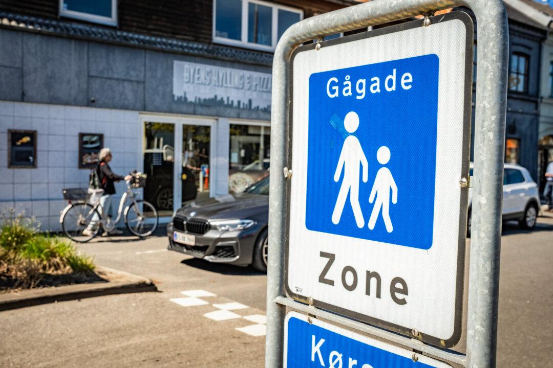 A sign signals traffic near a school in Ry, Denmark, on April 23, 2026. (John Fredricks/The Epoch Times)