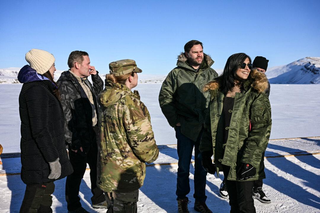 U.S. Vice President JD Vance (2nd R) and Second Lady Usha Vance (R), joined by national security adviser Mike Waltz (2nd L), tour the U.S. military’s Pituffik Space Base in Greenland on March 28, 2025. Jonas Faber, a Greenlandic Inuk activist living in Canada, said Danes fear the United States could use its military presence in Greenland to annex the island. (Jim Watson/Pool/Getty Images)