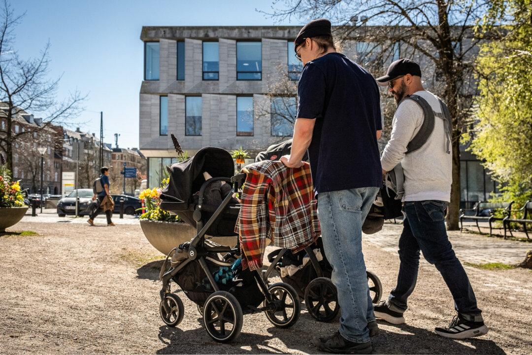 Men push strollers in Copenhagen, Denmark, on April 24, 2026. Greenlanders have long argued that the country's standardized parenting competency test was culturally biased and led to too many children being placed in foster care. (John Fredricks/The Epoch Times)
