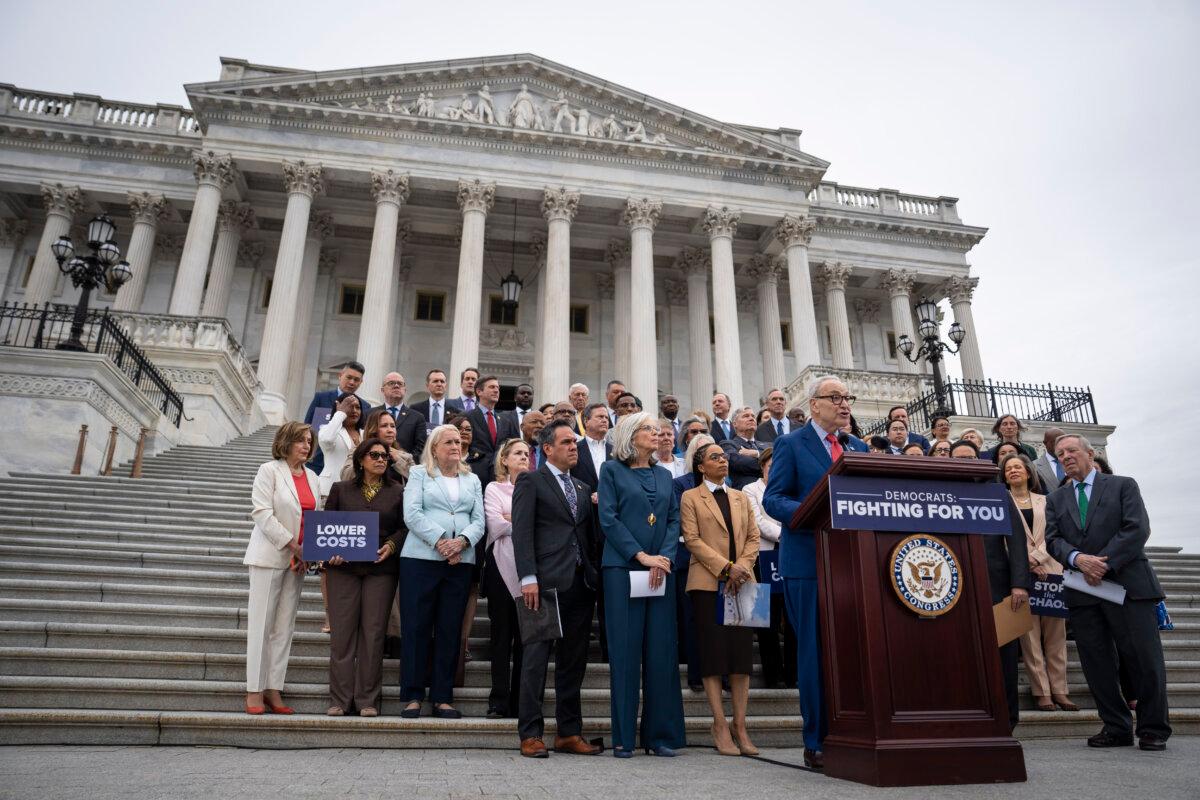 Senate Minority Leader Chuck Schumer (D-N.Y.), joined by other Democrat lawmakers, speaks in Washington on May 21, 2026. (Madalina Kilroy/The Epoch Times)