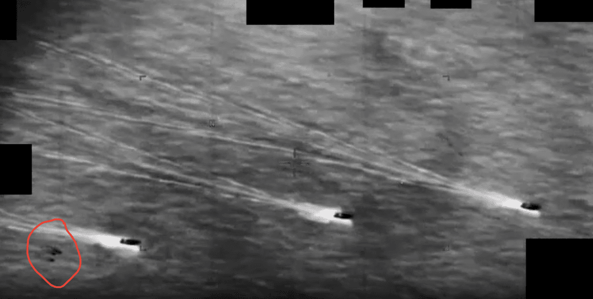 A UAP, or possibly more than one, appears on the lower left side of a classified video taken in Iran on August 2022. The red circle was added by The Epoch Times to clarify what the Department of War considered to be an unknown anomaly. (Department of War)