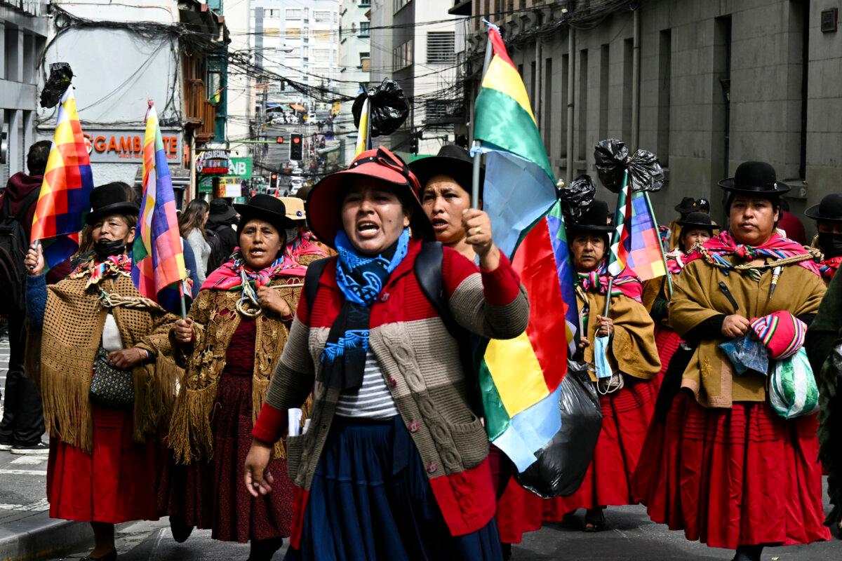 Women wearing traditional dress known as "cholitas" take part in a march calling for the resignation of President Rodrigo Paz, in La Paz, on May 22, 2026. (Aizar Raldes / AFP via Getty Images)