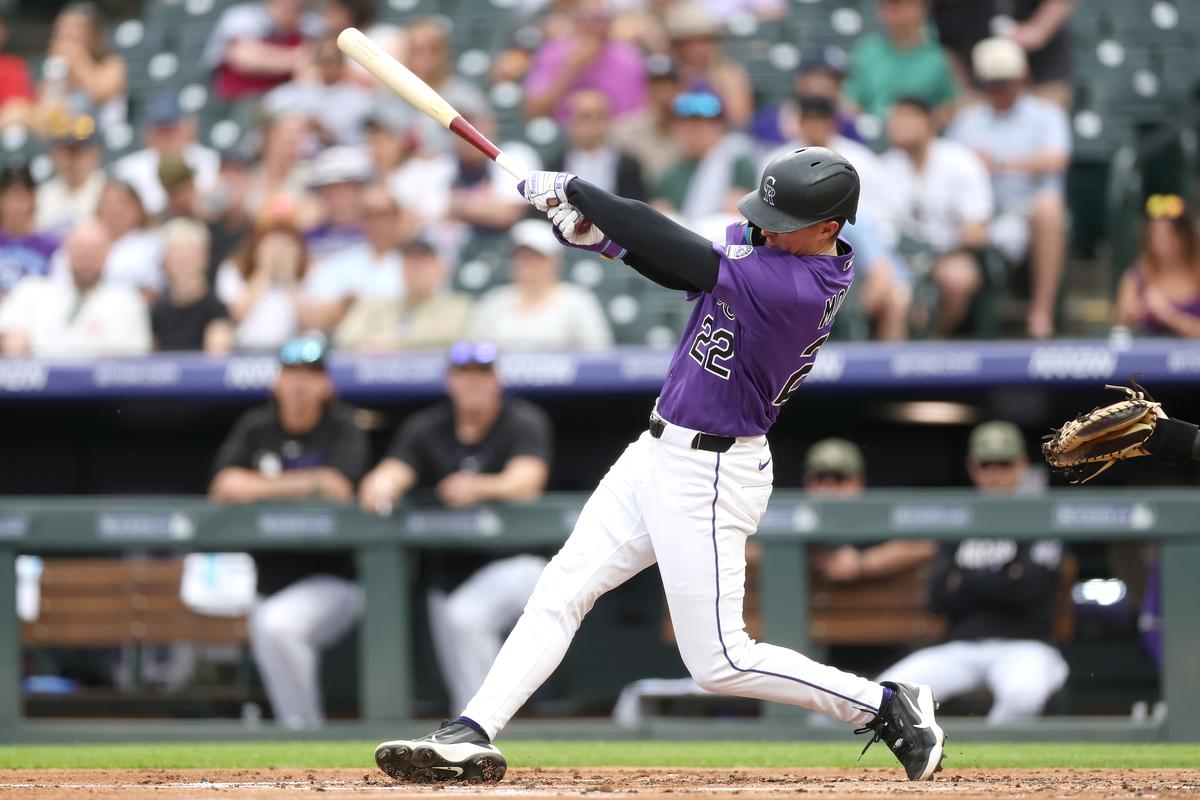 Mickey Moniak #22 of the Colorado Rockies hits an RBI single against the Arizona Diamondbacks in the first inning at Coors Field in Denver, Colo., on May 16, 2026. (Matthew Stockman/Getty Images)