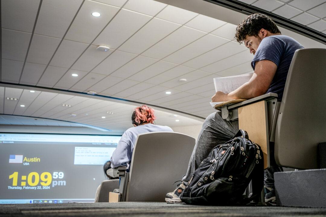 A student takes a final exam in a lecture hall at the University of Texas at Austin in Austin, Texas, on Feb. 22, 2024. Many colleges and universities stopped requiring SAT scores in recent years because of pandemic-related learning loss or efforts to increase racial diversity. (Brandon Bell/Getty Images)