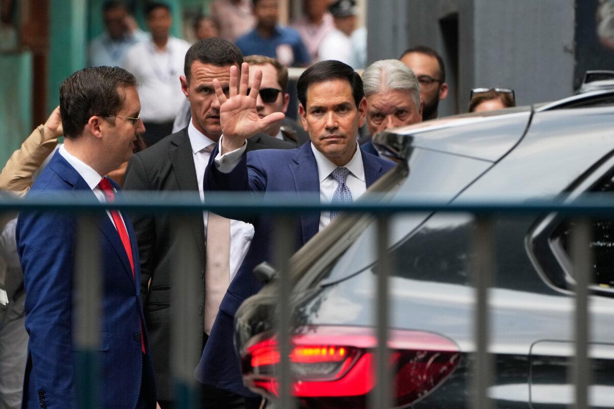 U.S. Secretary of State Marco Rubio (C) waves to reporters after a visit to Mother House, the headquarters of the Missionaries of Charity, in Kolkata, India, on May 23, 2026. (Bikas Das/AP Photo)