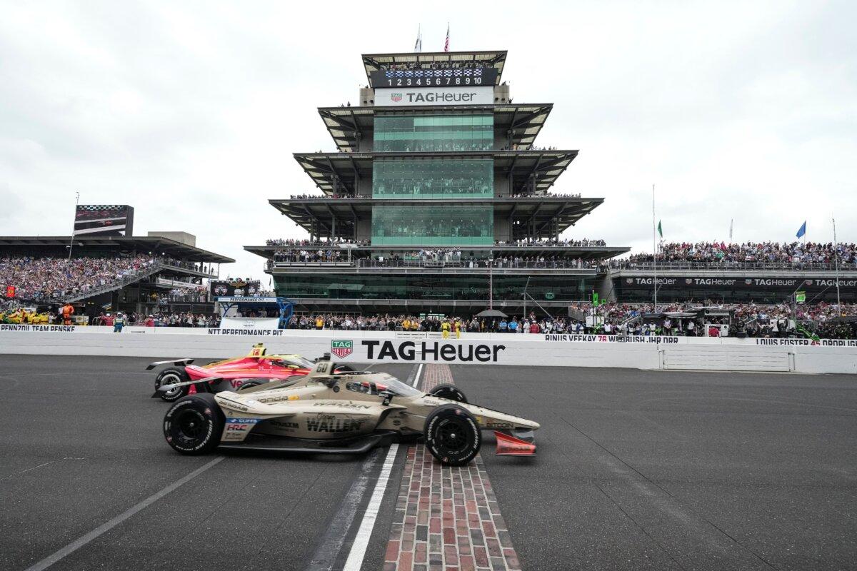 Felix Rosenqvist, foreground, of Sweden, beats David Malukas to the finish line to win the Indianapolis 500 auto race at Indianapolis Motor Speedway in Indianapolis on May 24, 2026. (AJ Mast/AP Photo)