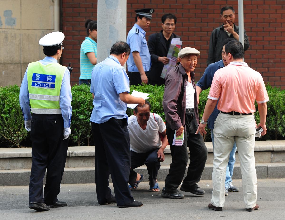 China Cuts 300,000 Enforcement Officers Amid Complaints of Abuse, Mounting Fiscal Stress