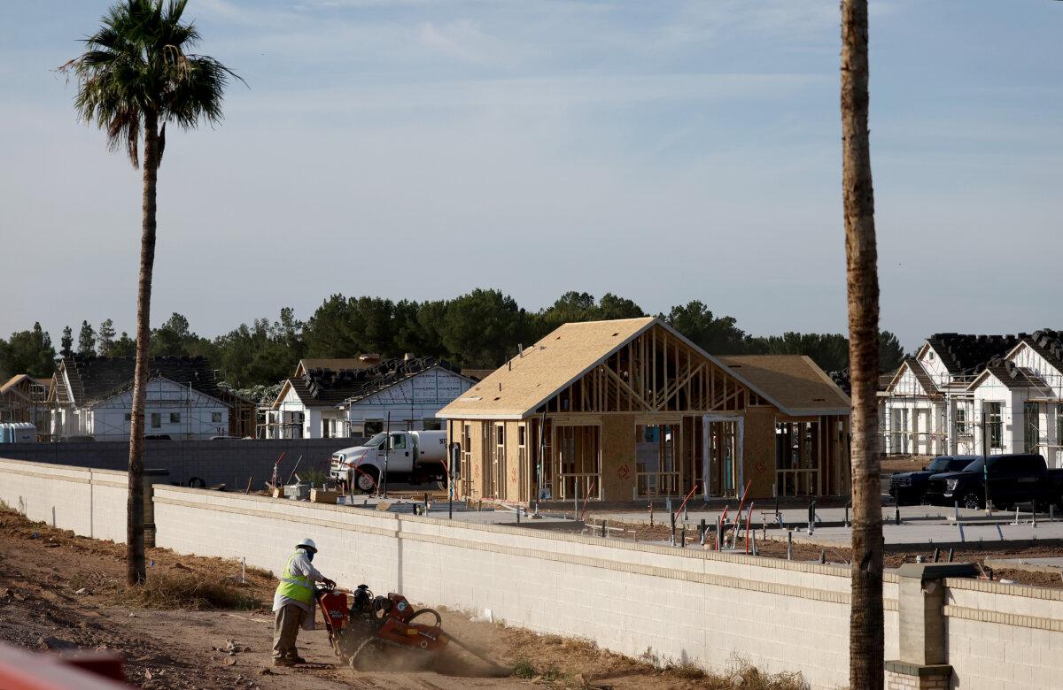 A worker operates machinery during construction at a housing development in the Phoenix suburbs in Queen Creek, Arizona, on June 9, 2023. (Mario Tama/Getty Images)