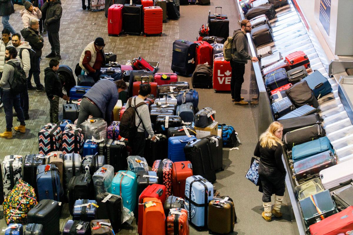 Luggage are amassed in the bag claim area at Toronto Pearson International Airport in a file photo. (The Canadian Press/Cole Burston)