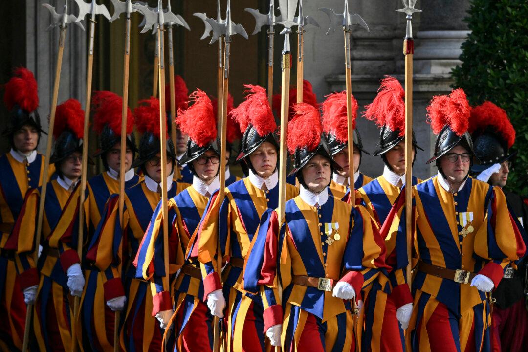 Swiss Guards take position before the arrival of Spain's Prime Minister Pedro Sanchez in San Damaso courtyard for a meeting with Pope Leo XIV, in the Vatican on May 27, 2026. (Photo by Alberto PIZZOLI / AFP via Getty Images)