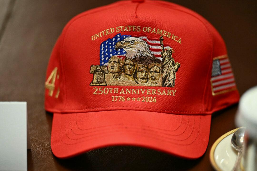A hat reading "United States of America, 250th Anniversary" sits in front US President Donald Trump during a cabinet meeting in the Cabinet Room of the White House in Washington, DC, on May 27, 2026. (Photo by Kent NISHIMURA / AFP via Getty Images)
