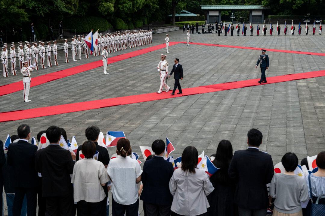 Philippine President Ferdinand Marcos Jr. inspects a guard of honor at the Imperial Palace during a state visit in Tokyo on May 27, 2026. (Photo by Andrew CABALLERO-REYNOLDS / POOL / AFP via Getty Images)