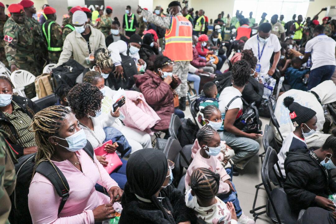 Ghanaian nationals evacuated from South Africa following xenophobia attacks wait upon their arrival at Accra International Airport in Accra on May 27, 2026. Ghana on May 26, announced it was evacuating 300 citizens from South Africa, after an upsurge in xenophobic incidents across the country in recent weeks. (Photo by Nipah Dennis / AFP via Getty Images)