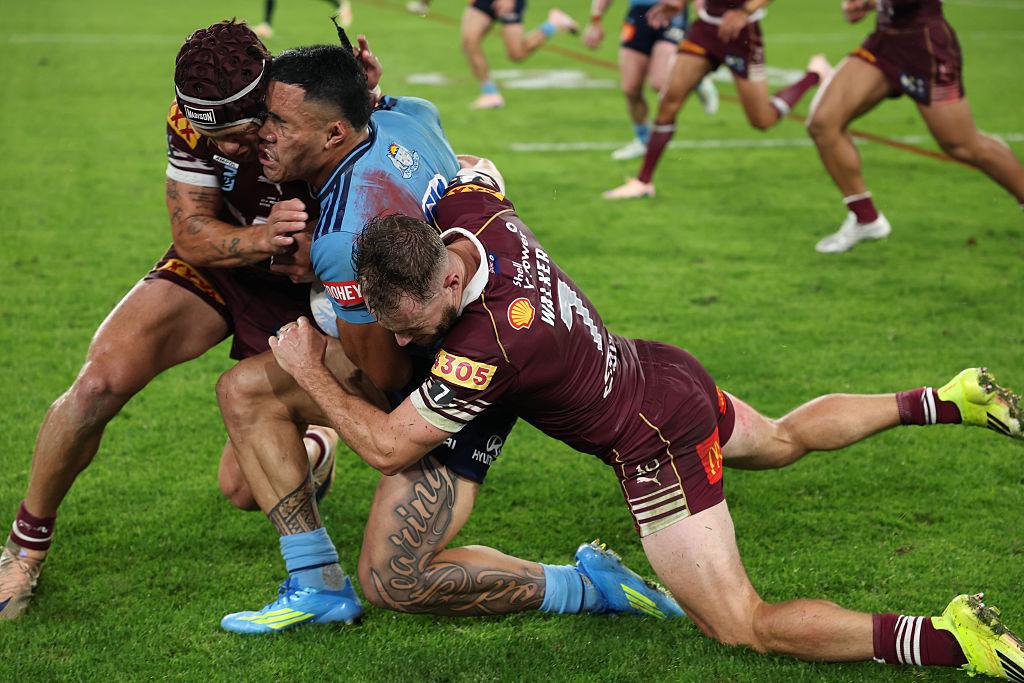 Tolutau Koula of the Blues is tackled by Kalyn Ponga of the Maroons during game one of the 2026 Men's State of Origin series between New South Wales Blues and Queensland Maroons at Accor Stadium in Sydney, Australia on May 27, 2026. (Darrian Traynor/Getty Images)