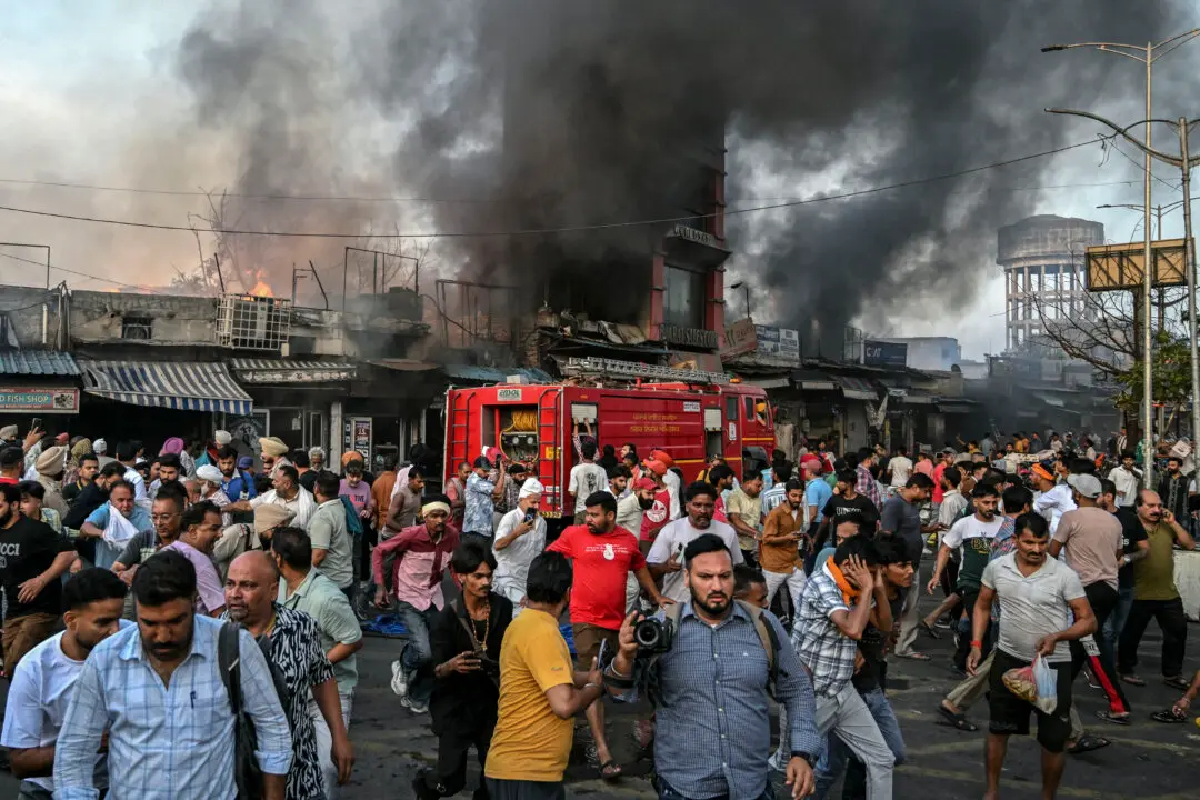 Day in Photos: Market Fire in India, Air Force Graduation, and Armenia’s Republic Day