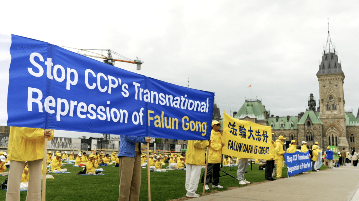 Falun Gong practitioners protest on Parliament Hill as Chinese Foreign Affairs Minister Wang Yi visits Ottawa on May 29, 2026. (NTD)