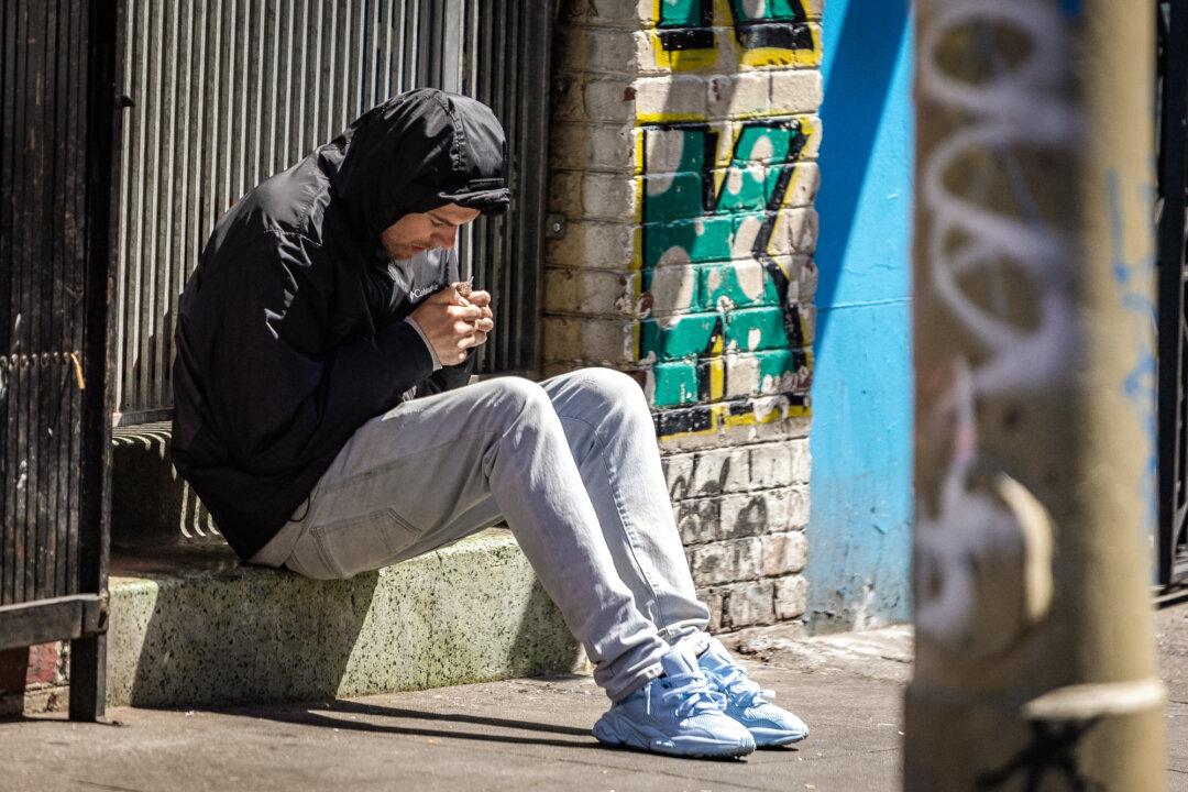 A man uses drugs in the Tenderloin District of San Francisco on May 16, 2024. The city has seen 184 drug overdose deaths since January, according to the San Francisco Medical Examiner's office. (John Fredricks/The Epoch Times)