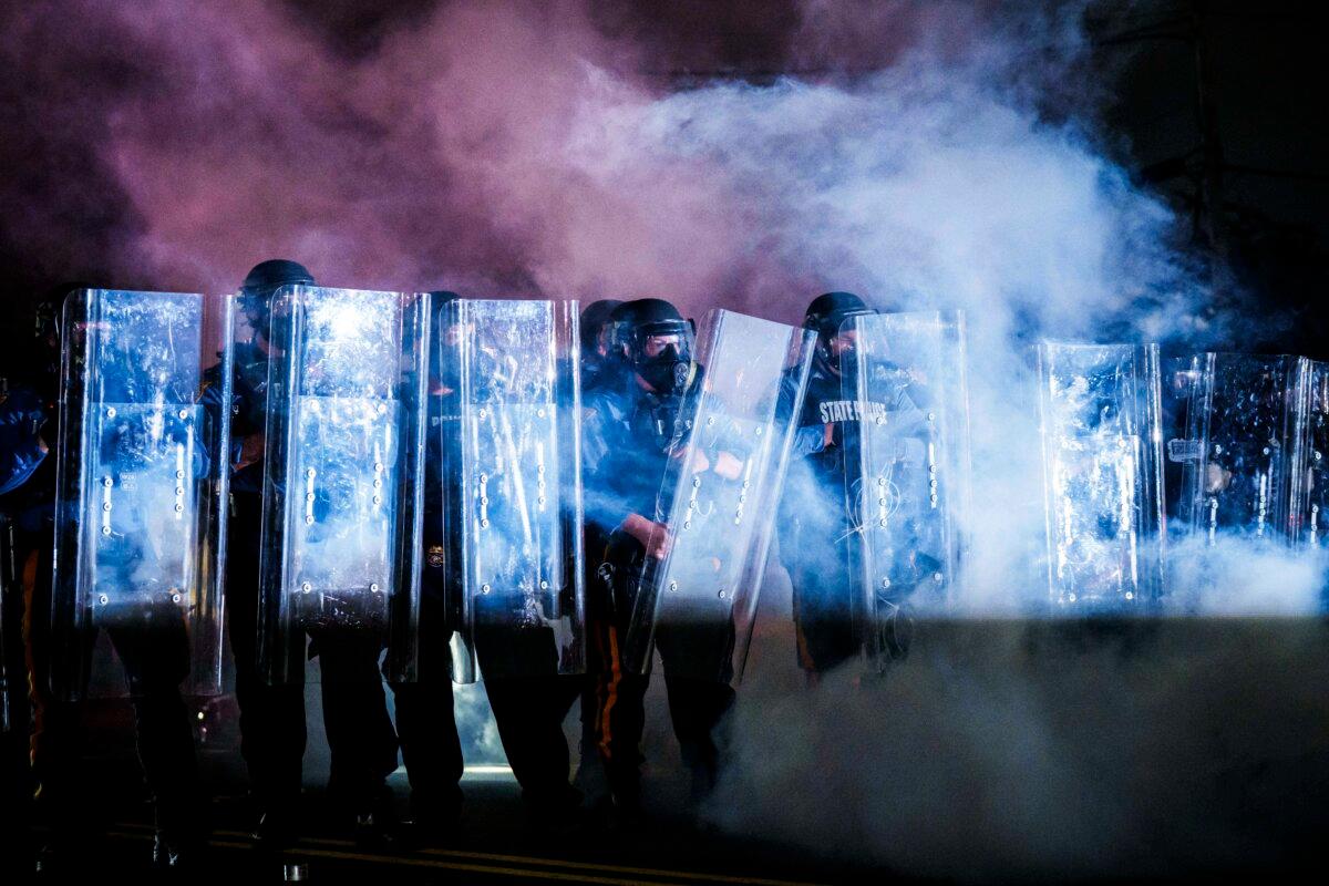 New Jersey State Police use tear gas as they clear protestors from outside of the federal immigration center at Delaney Hall in Newark, where ICE is housing detained immigrants, on May 29, 2026. (Adam Gray/Getty Images)