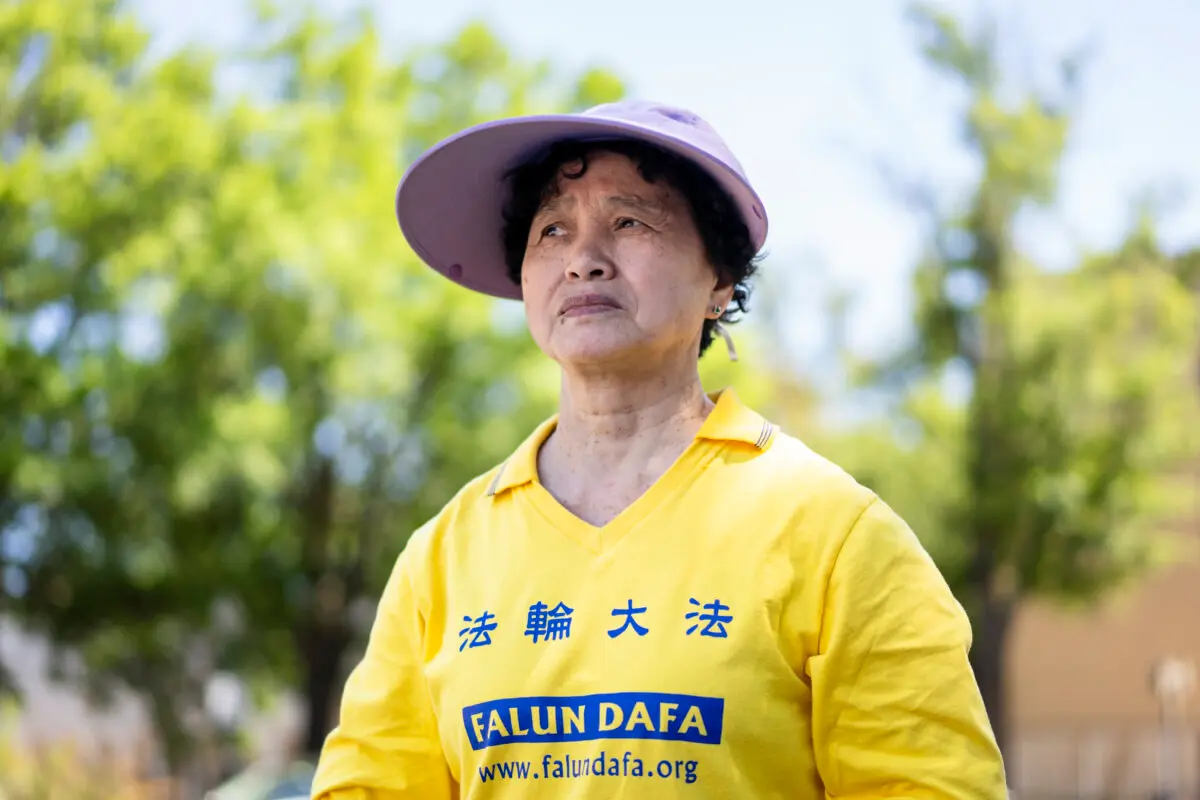 Tong Shuzhen stands in front of the Chinese Embassy in Washington on May 30, 2026. Tong's sister Tong Shuying has been detained since April in Wuhan, China, because of her faith. (Madalina Kilroy/The Epoch Times)