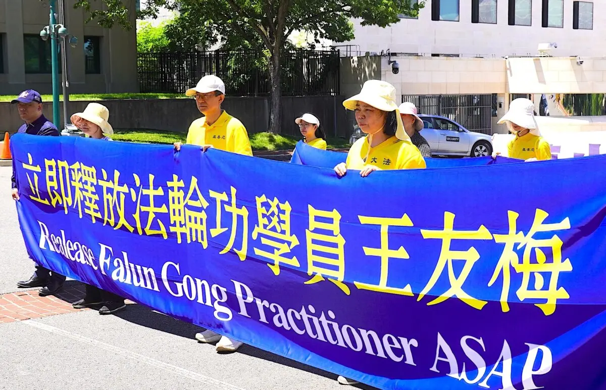 Falun Gong practitioners gather in front of the Chinese Embassy to call attention to the plight of their faith community under the communist regime's brutal persecution in Washington on May 30, 2026. (Sherry Dong/The Epoch Times)