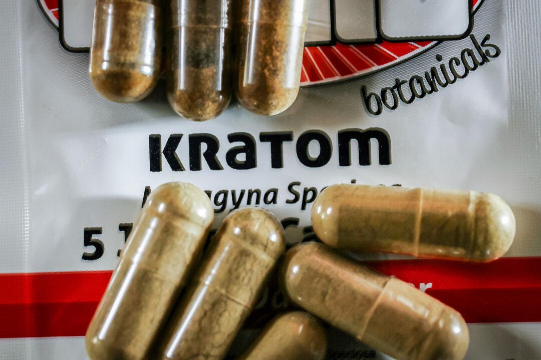 In this photo illustration, capsules of the herbal supplement Kratom are seen in Miami on May 10, 2016. The herbal supplement is a psychoactive drug derived from the leaves of the kratom plant. (Joe Raedle/Getty Images)
