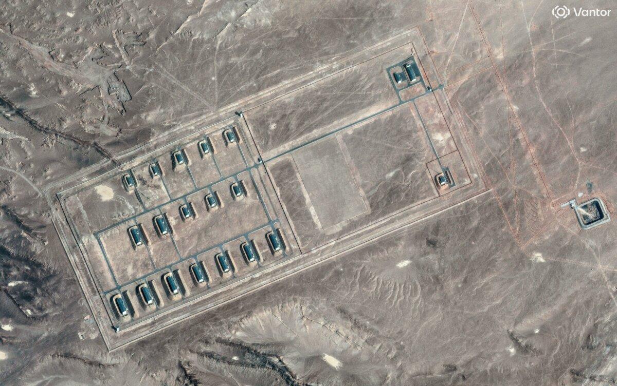 A satellite image shows what security analysts say is a fortified weapons storage installation, revealing revetments around the building, a perimeter wall and guard towers, in the Xinjiang region of China on March 19, 2026. (Vantor/Handout via Reuters)