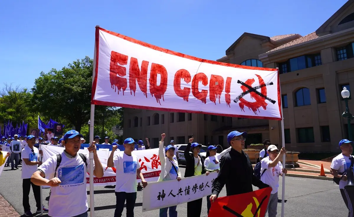 Chinese dissidents and democracy activists hold a rally in front of the Chinese Embassy in Washington to commemorate the 37th anniversary of the Tiananmen Square Massacre and to demand democracy in China, in Washington on May 30, 2026. (Li Chen/The Epoch Times)