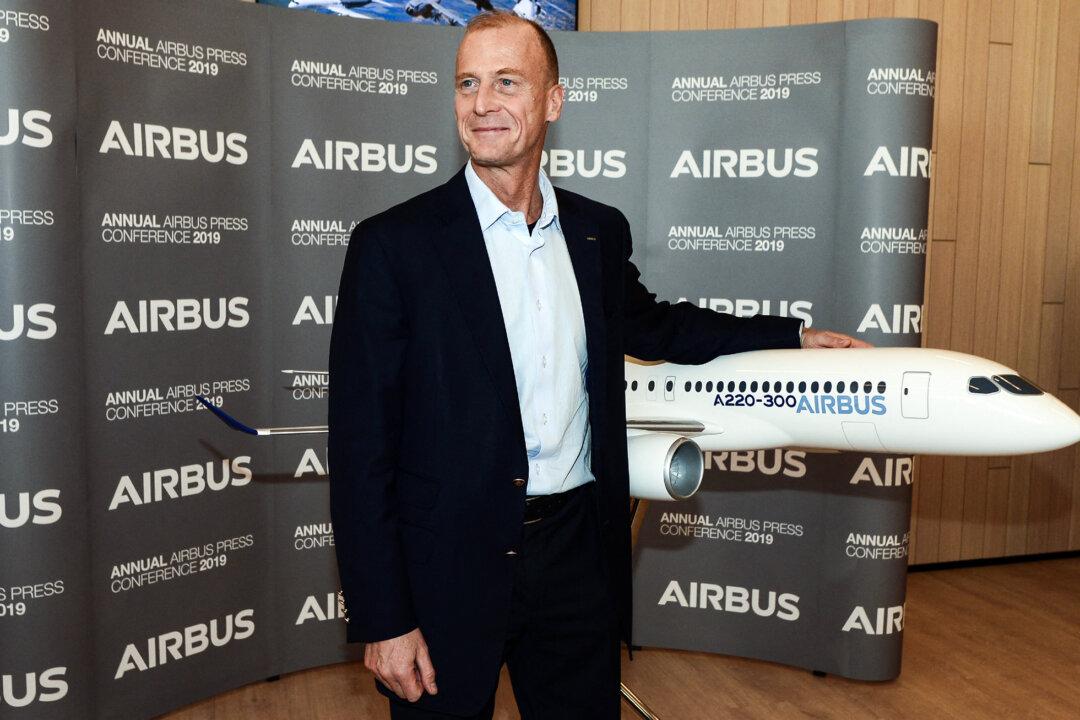 Tom Enders, Airbus executive chairman, poses next to an Airbus plane model as he presents the company's annual results during a press conference in Blagnac, France, on Feb. 14, 2019. A paper last month co-authored by Enders compared the effort to close the European defense capability gap to the Manhattan Project. (Remy Gabalda/AFP via Getty Images)