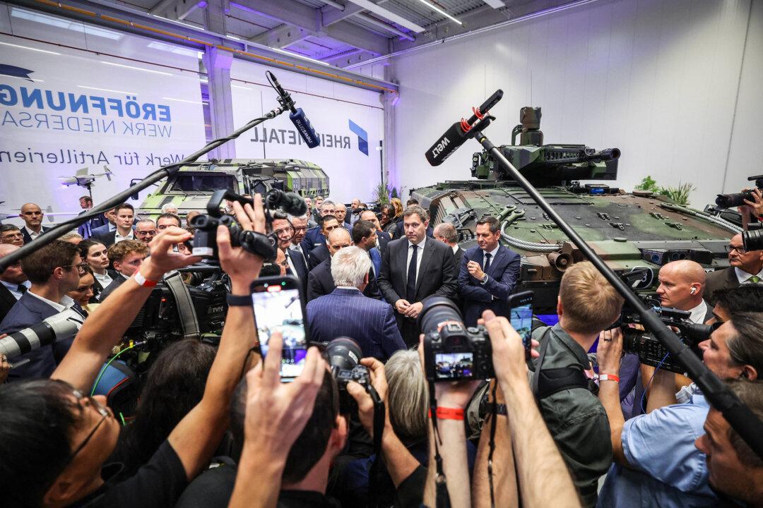 German Vice Chancellor Lars Klingbeil (C) visits the site of Rheinmetall's new artillery plant in Unterluess, Germany, on Aug. 27, 2025. At 30,000 square metres, the factory will be able to produce 350,000 artillery shells a year by 2027. (Ronny Hartmann/AFP via Getty Images)
