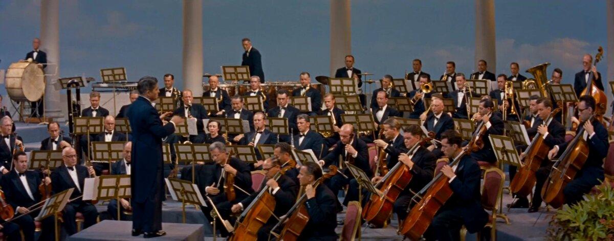 Alfred Newman conducts the orchestra in the prelude to "How to Marry a Millionaire." (Paramount Pictures)