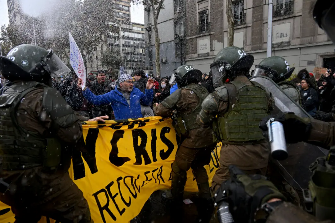 Day in Photos: Demonstration in Chile, Military Helicopter Crash, and Fire in India