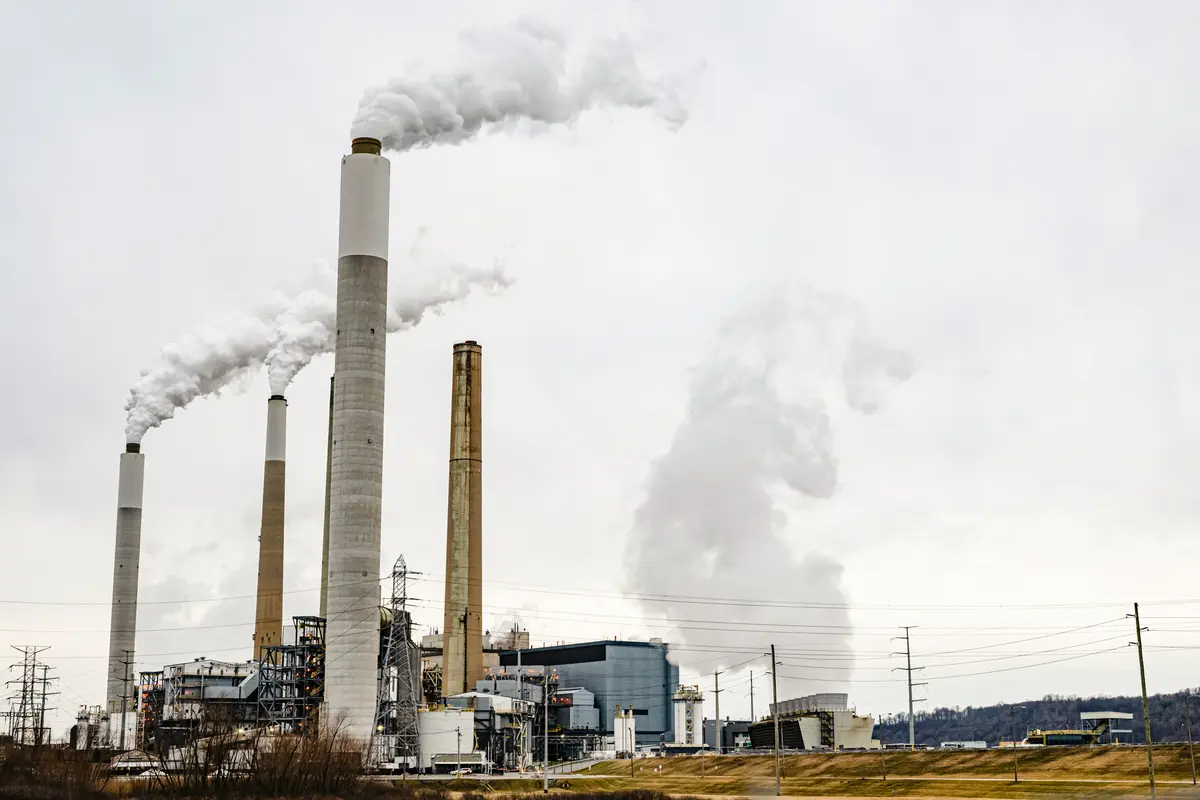 Flue-gas stacks of a coal-fired power plant are seen from the Valley Village neighborhood in Louisville, Ky., on Feb. 14, 2026. (Jon Cherry/Getty Images)