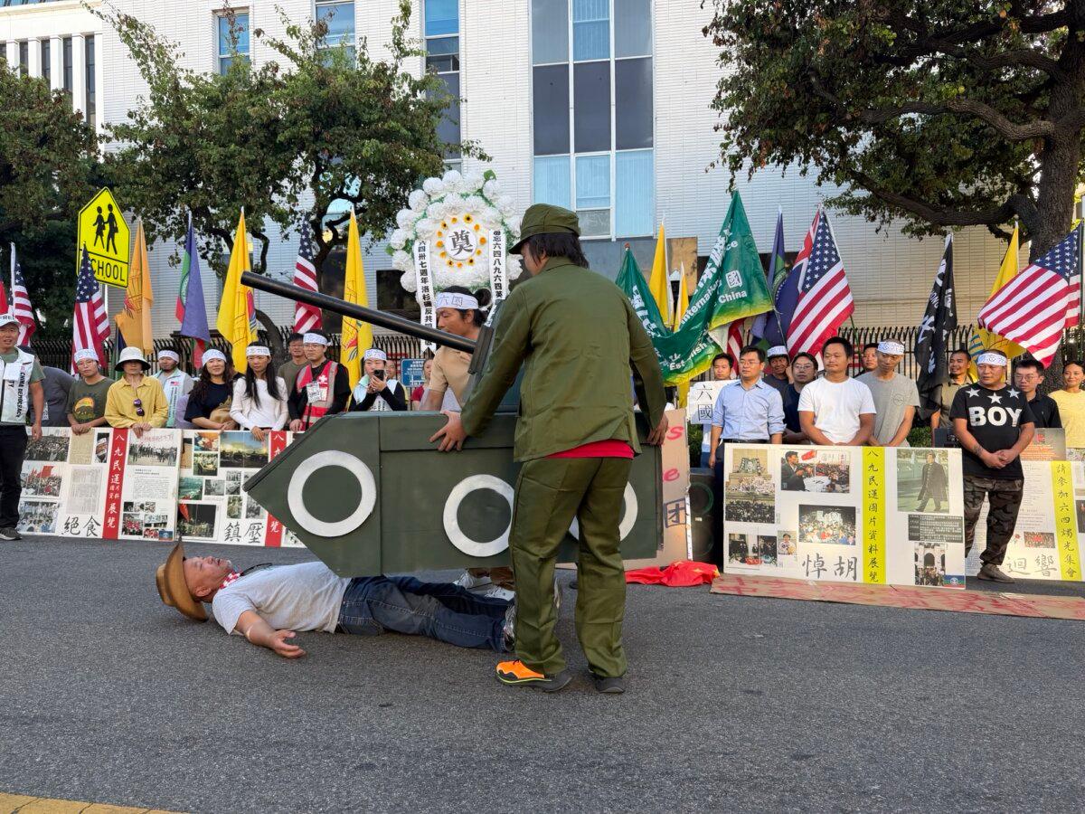 Participants in Los Angeles use a cardboard tank model during a May 31, 2026, memorial event marking the 37th anniversary of the Tiananmen Square massacre. (Courtesy of China Democracy Party International Alliance)