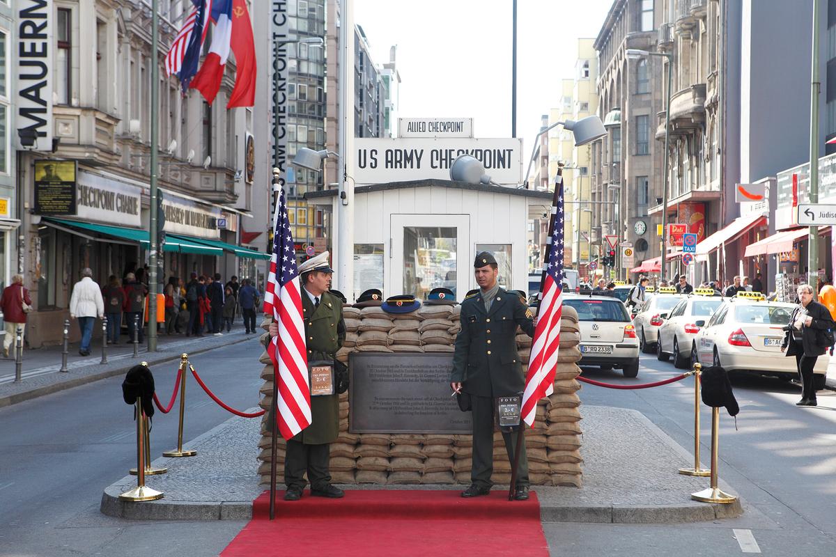 Checkpoint Charlie was established in 1961 after the completion of the Berlin Wall. it was primarily used by diplomats, military personnel, journalists, and foreign visitors. (narvikk/Getty Images)