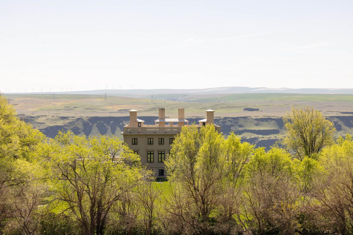 Maryhill Museum peeks out from the willow and cottonwood trees in Washington state. (Courtesy of Maryhill Museum of Art)