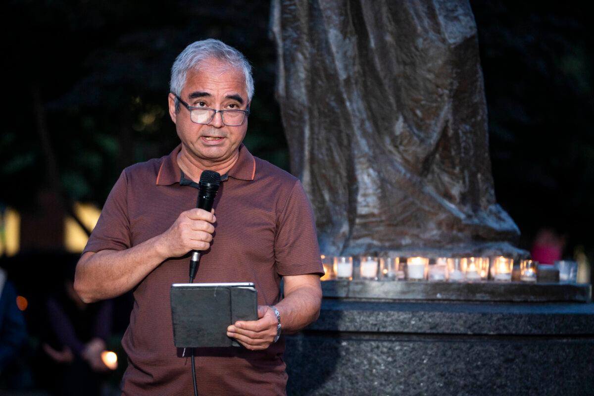 Ilshat Kokbore, research director at the Uyghur Studies, speaks during a candlelight vigil to commemorate the 1989 Tiananmen Square Massacre, at the Victims of Communism Memorial in Washington on June 4, 2026. (Madalina Kilroy/The Epoch Times)