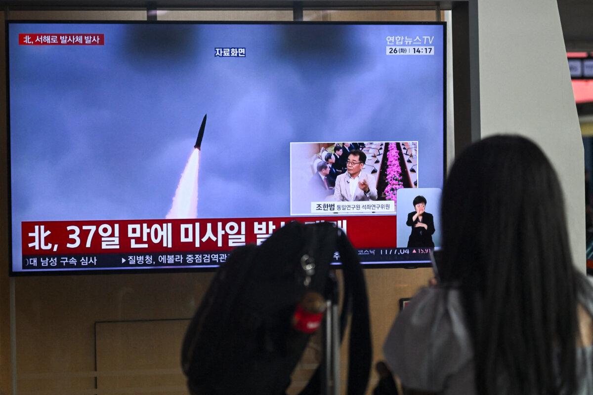 A television screen showing a news broadcast with file footage of a North Korean missile test, at a train station in Seoul, South Korea, on May 26, 2026. (Pedro Pardo/AFP via Getty Images)