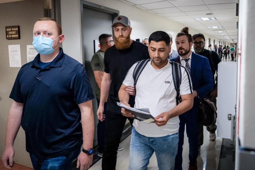A man is detained by plainclothes officers with Immigration and Customs Enforcement after his immigration court hearing at the Jacob K. Javits Federal Building in New York City on June 6, 2025. Former federal prosecutor Neama Rahmani said the detention issue ‘affects hundreds of thousands, maybe millions of people.’ (Adam Gray/Getty Images)
