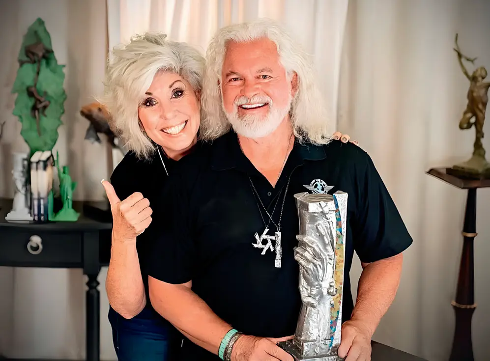 Leesa Clark-Price and Gary Lee Price with a model of the Statue of Responsibility. (Courtesy of Leesa and Gary Price)