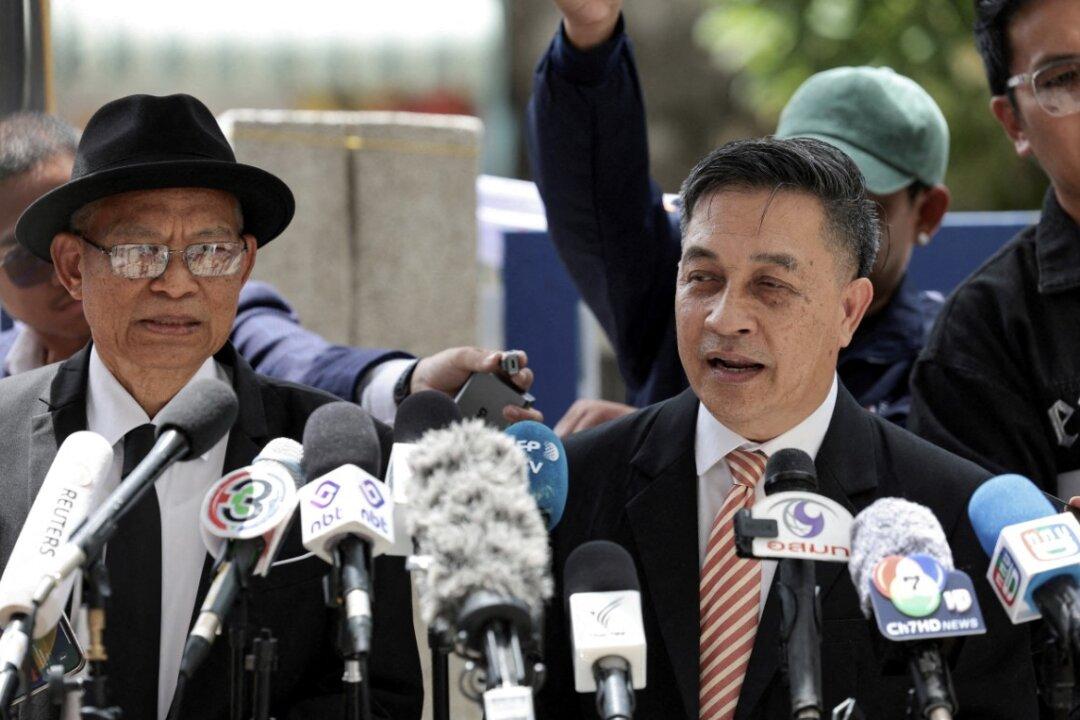 Choochat Kanpai (L) and Chamroen Panompakakorn (R), lawyers representing Bilal Mohammed and Yusufu Mieraili, respectively, speak to the members of the press outside South Bangkok Criminal Court, in Bangkok, Thailand, on June 11, 2026. (Chalinee Thirasupa/Reuters)