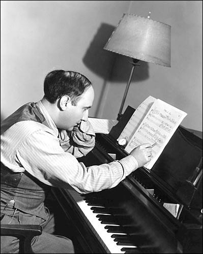 Dimitri Tiomkin works on a musical score in 1937. (Public Domain)