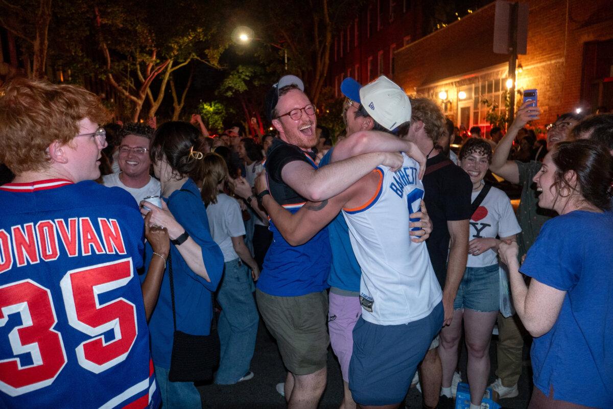 People celebrate after the New York Knicks beat the San Antonio Spurs in Game Five of the NBA finals, in New York City on June 13, 2026. (Spencer Platt/Getty Images)