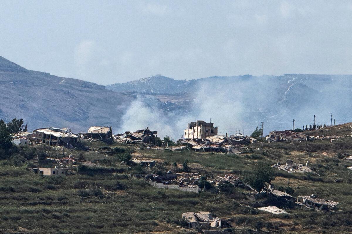 Smoke rises near destroyed structures in southern Lebanon, as seen from the Israeli side of the Israel-Lebanon border, in northern Israel, on June 14, 2026. (Avi Ohayon/Reuters)