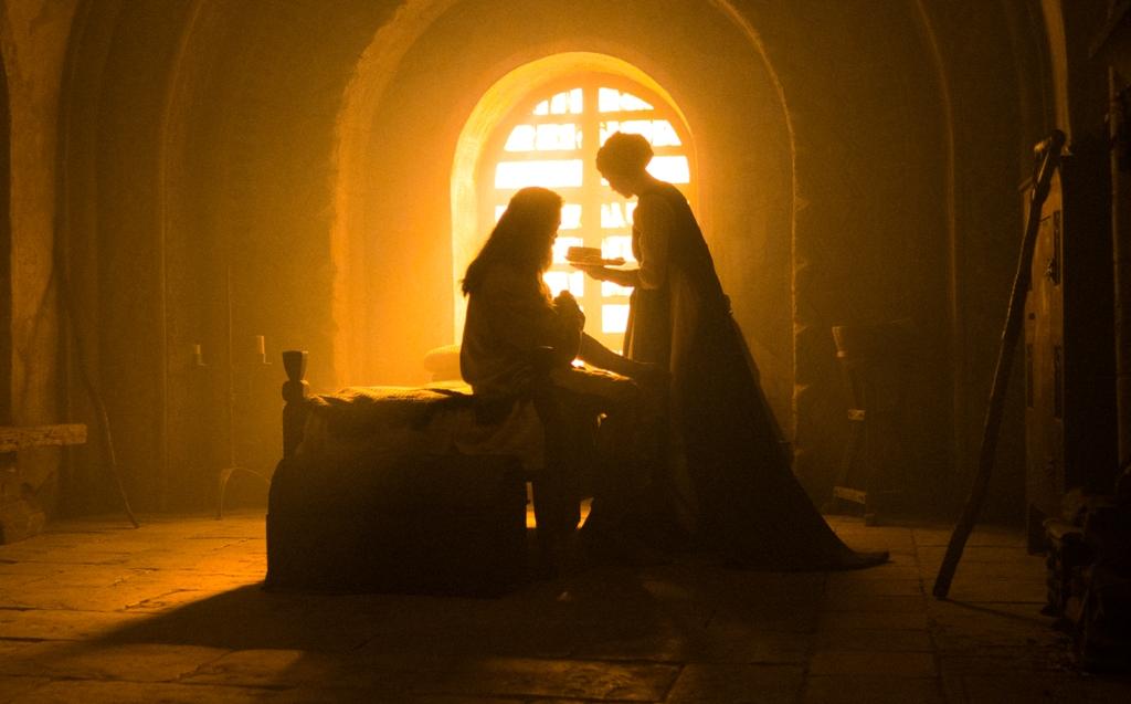 Robin Hood (Hugh Jackman) is cared for by Sister Brigid (Jodie Comer), in "The Death of Robin Hood." (A24)