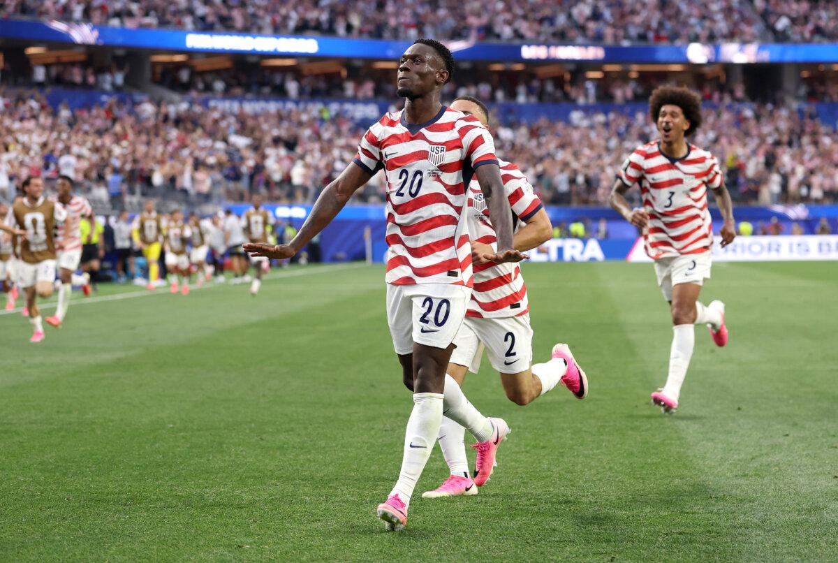 Folarin Balogun (#20) of the United States celebrates scoring his team's third goal during the Group D match against Paraguay at Los Angeles Stadium on June 12, 2026. (Richard Heathcote/Getty Images)