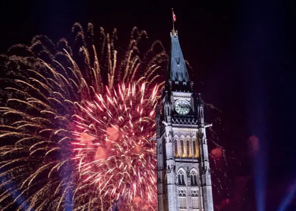 Fireworks explode over the Peace Tower on Parliament Hill at the end of Canada Day celebrations, in Ottawa on July 1, 2018. (The Canadian Press/Justin Tang)