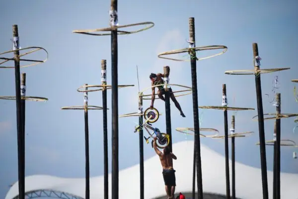 Participants in a greased-pole climbing competition, held to celebrate Indonesia's 80th Independence Day, on Aug. 17, 2025. (AP Photo/Tatan Syuflana)